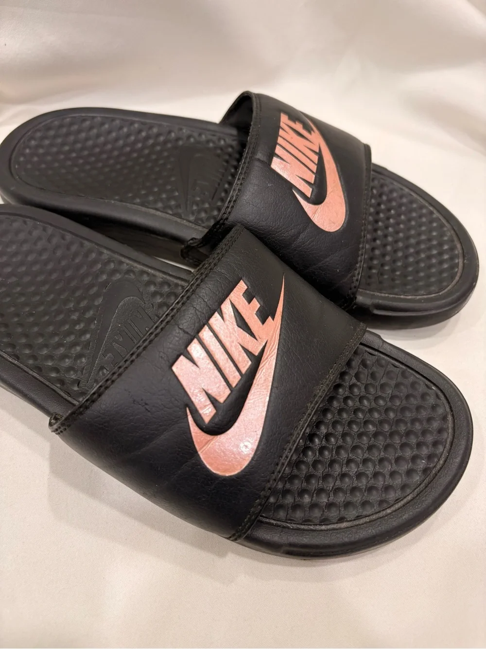 Woman’s Nike Benassi Black and Rose Gold Slides Size 7